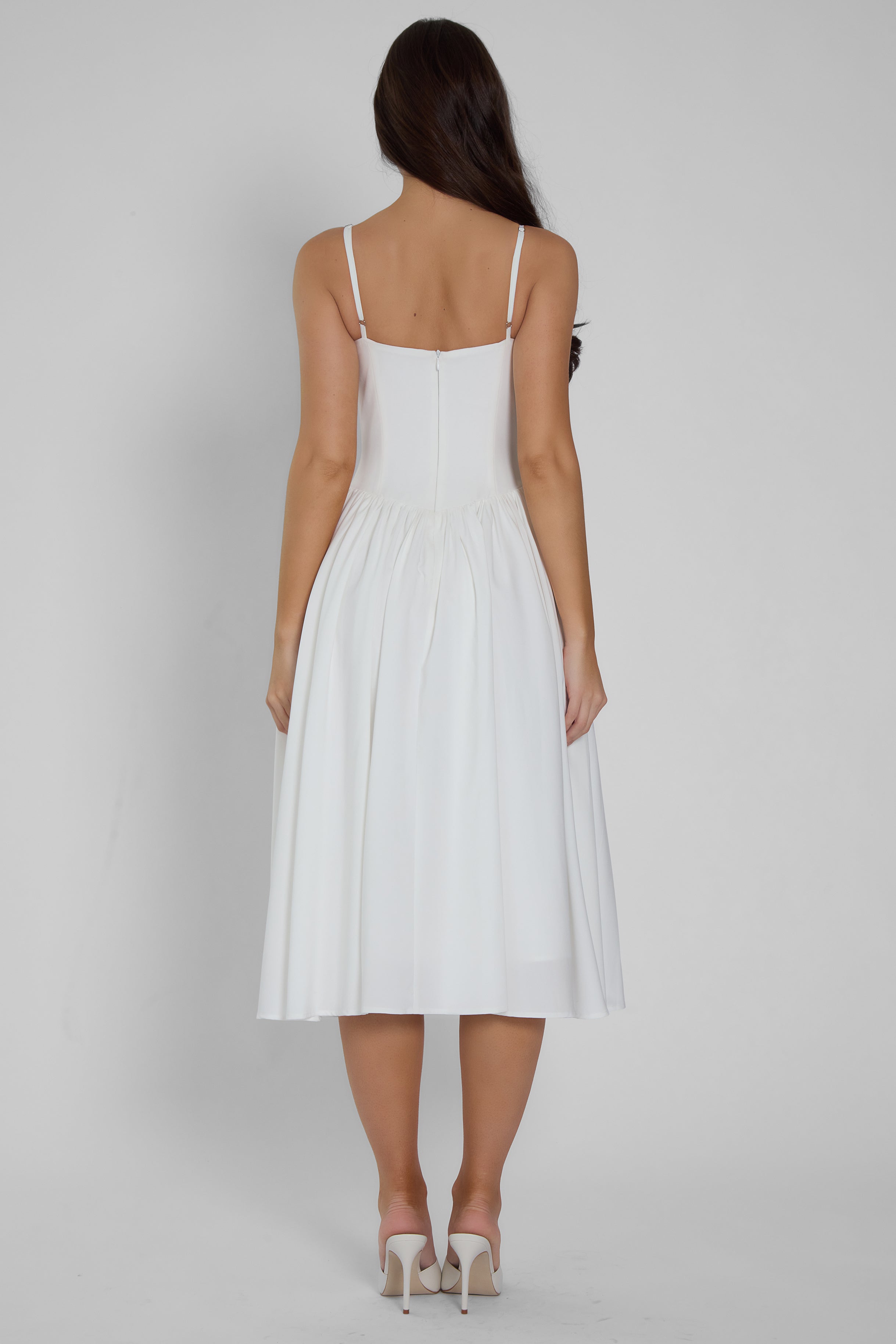 Model wearing Ballerina Bustier Midi Dress in White, back view.