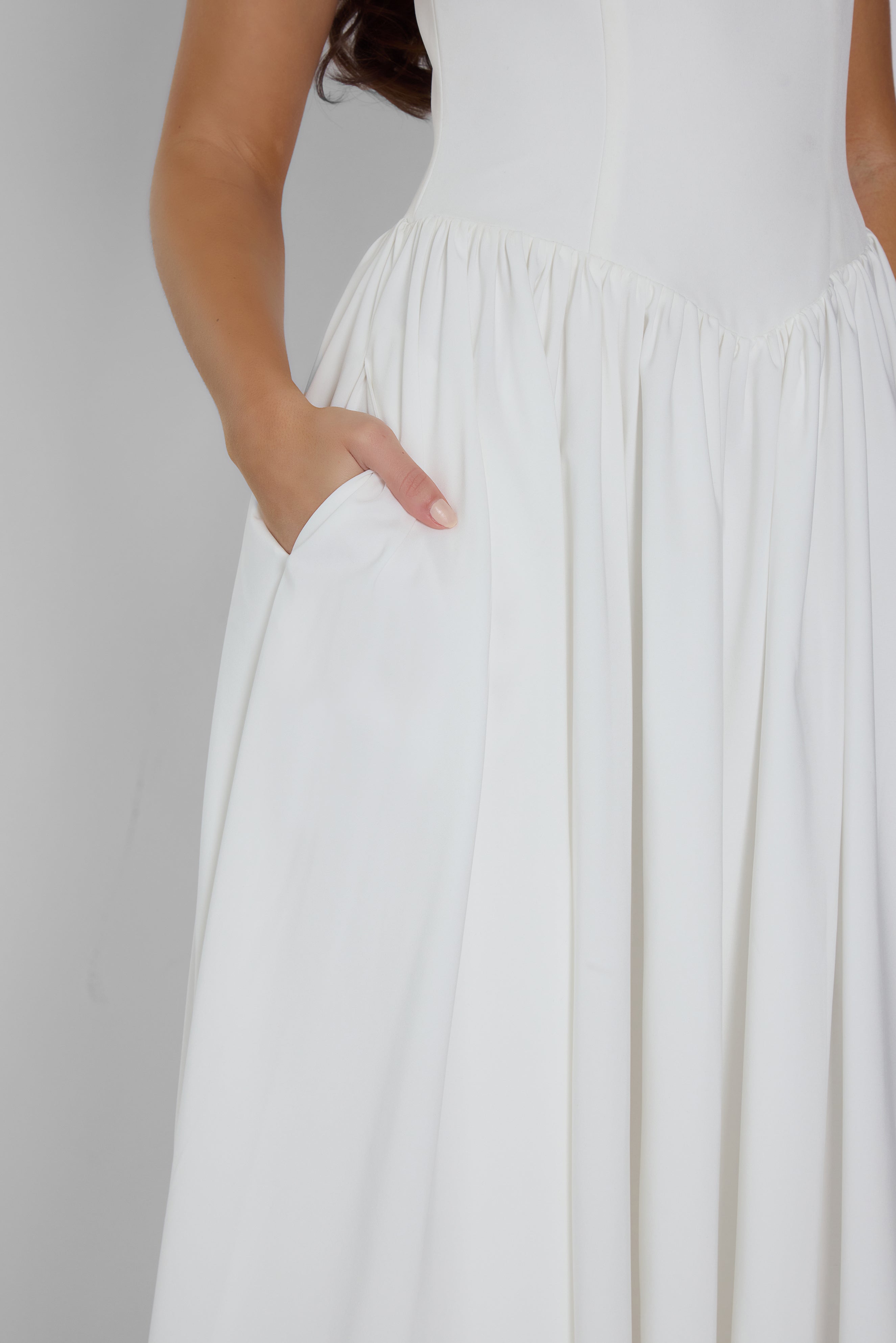 Model wearing Ballerina Bustier Midi Dress in White, front view.