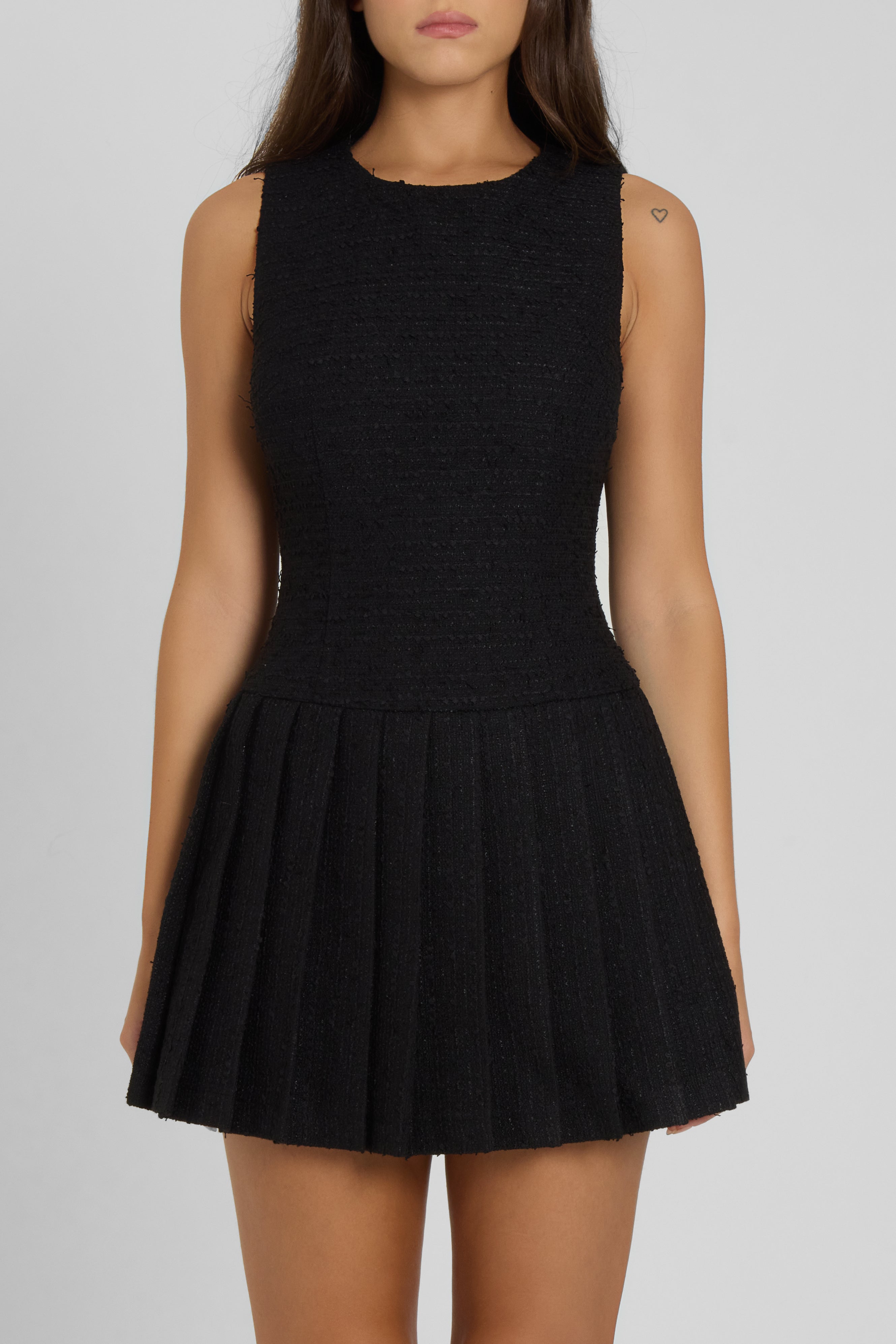 Model wearing Boa Boucle Mini Dress in Black, front view.