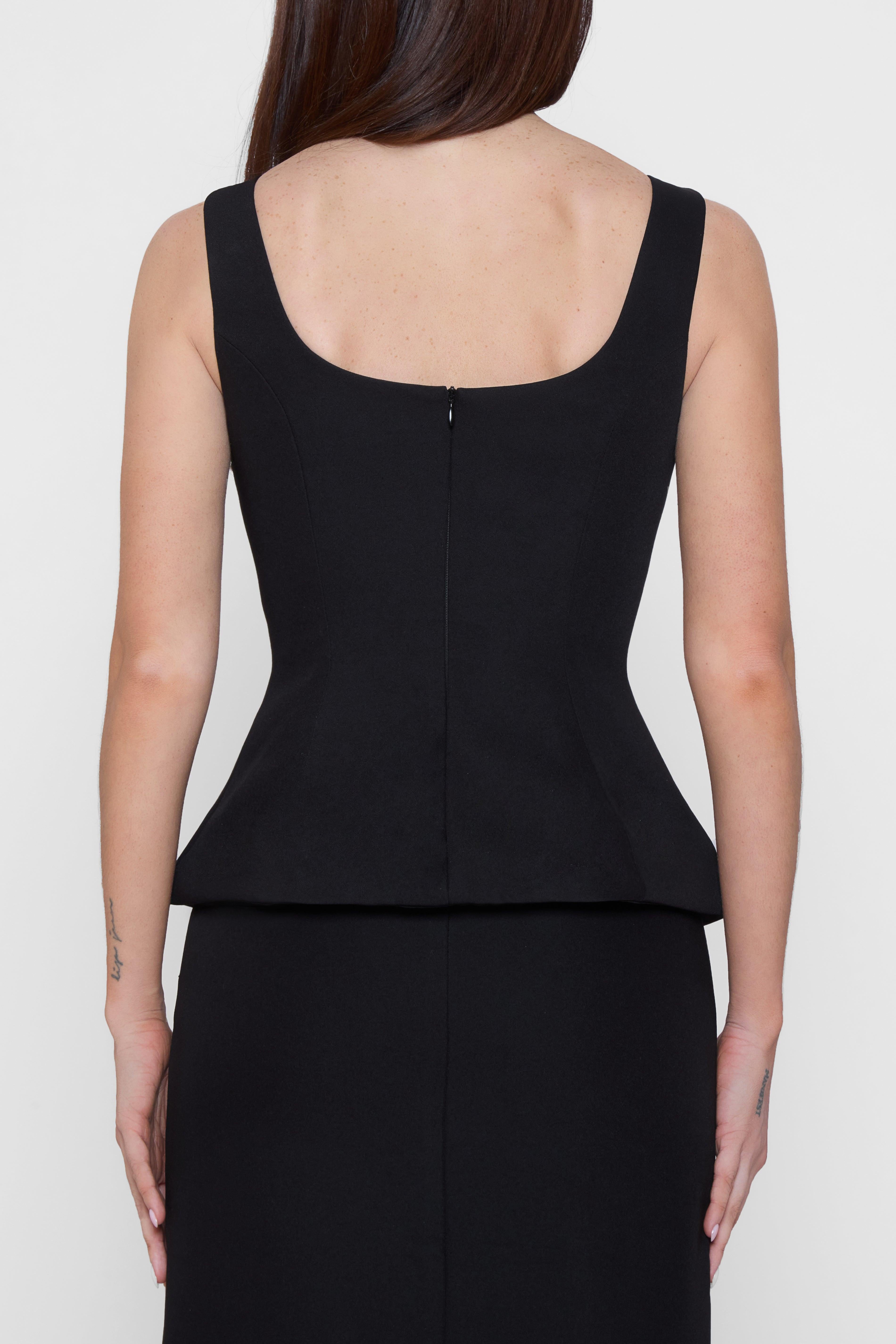 Model wearing LEAU Calesia Contour Bustier Top in Black, back view.