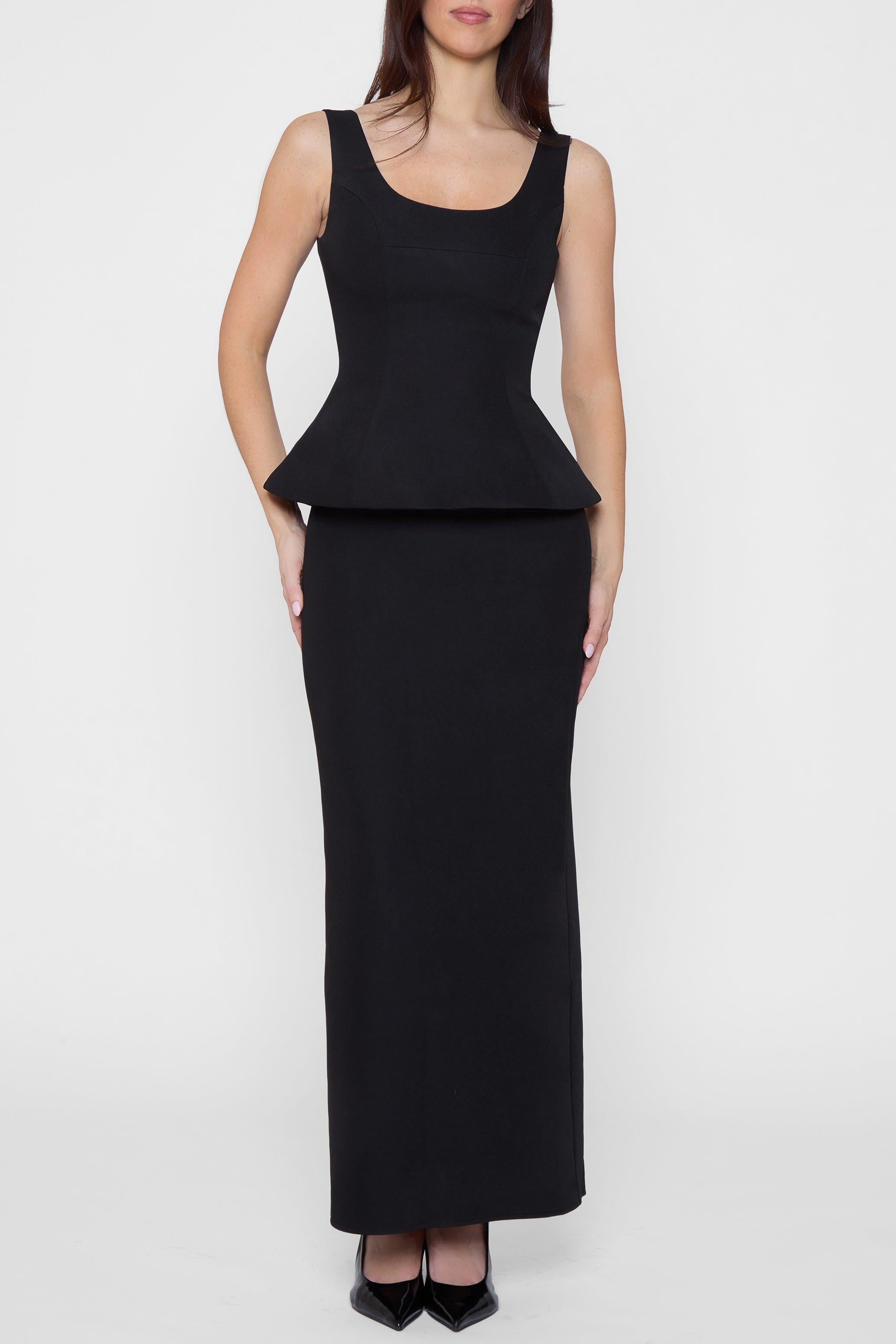 Model wearing Classic Column Maxi Skirt in Black, front view.