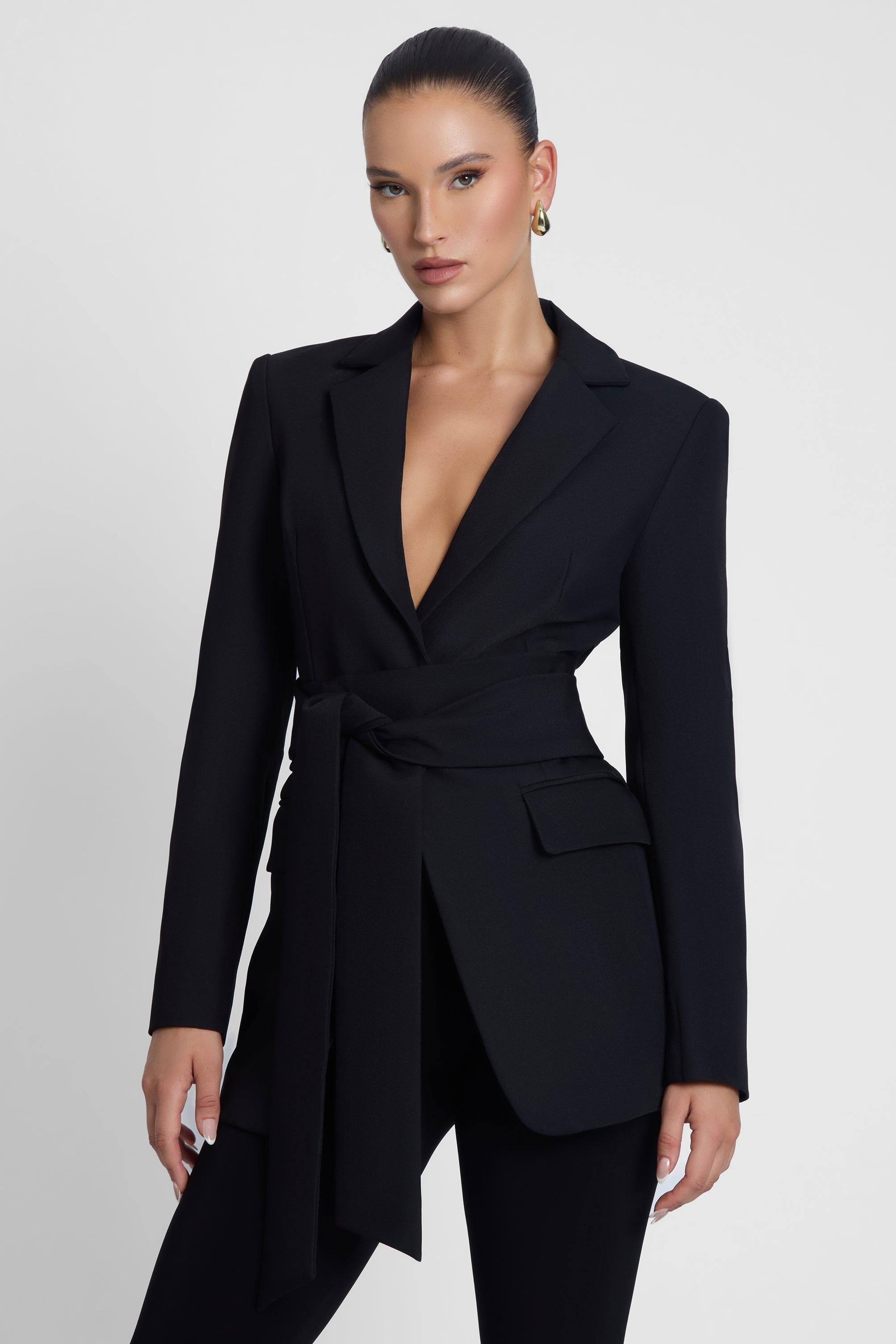 Model is wearing Classic Column Tailored Belted Blazer Black, side view.