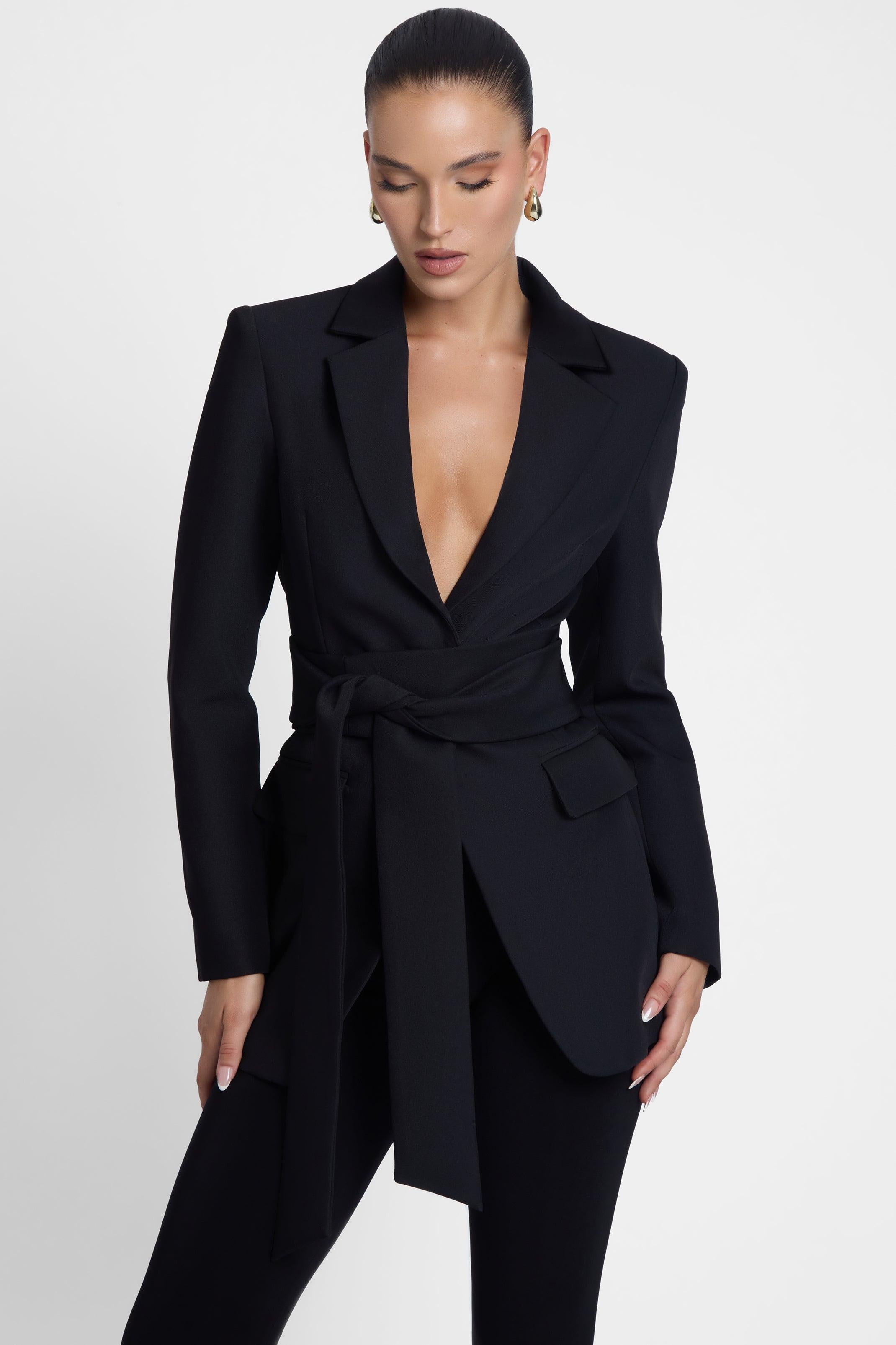 Model is wearing Classic Column Tailored Belted Blazer Black, front view.