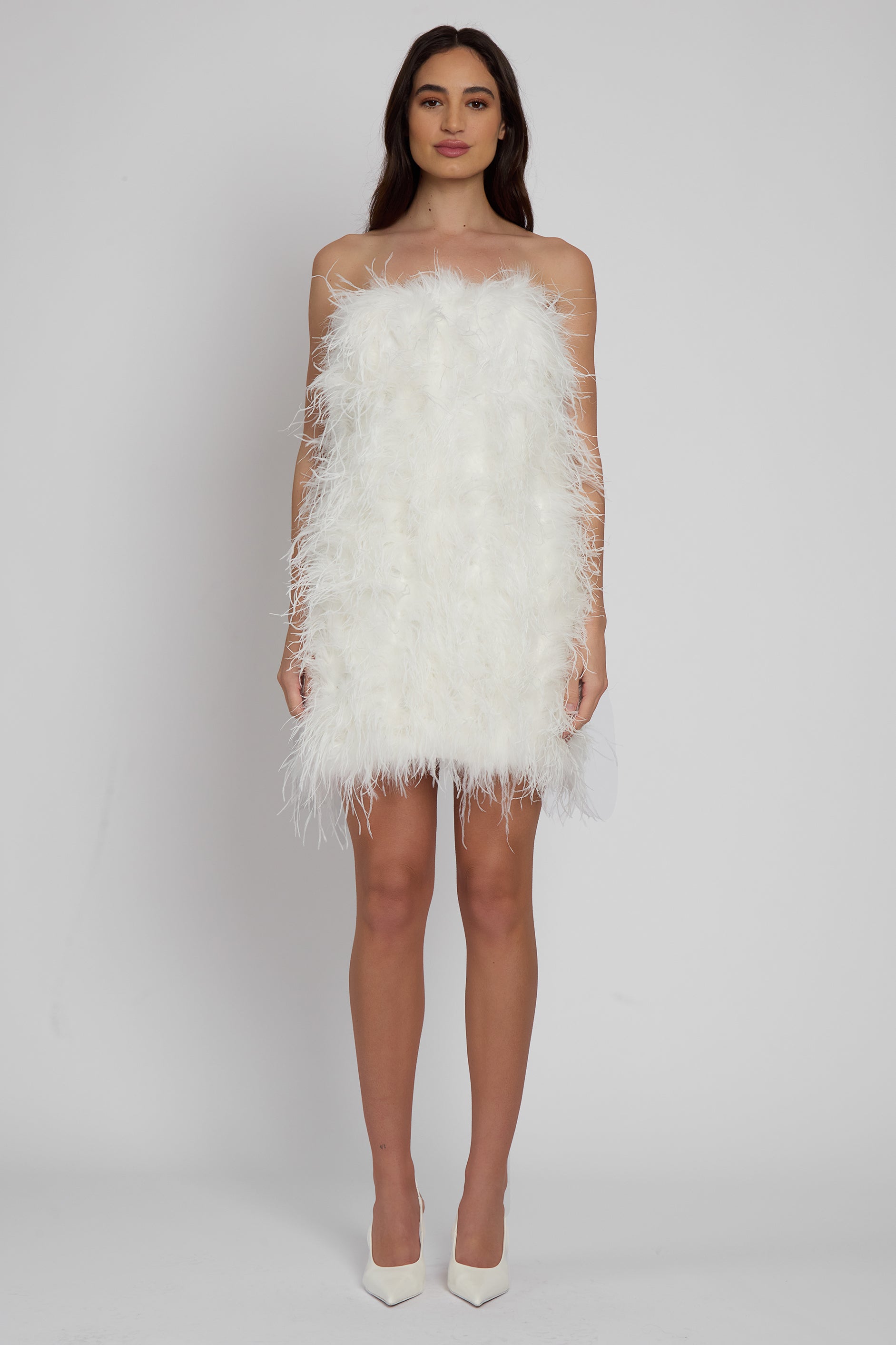 Model wearing Cloud Feather Mini Dress in White, front view.