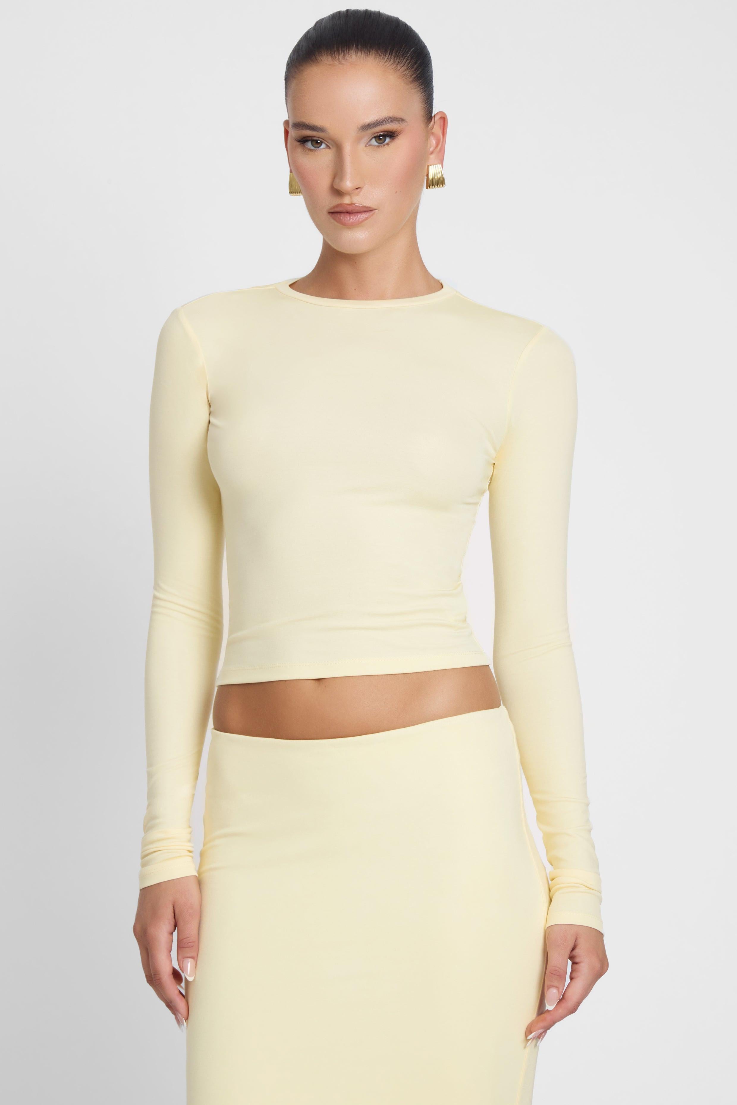 Model is wearing Everyday Jersey Long Sleeve Top Yellow, front view.