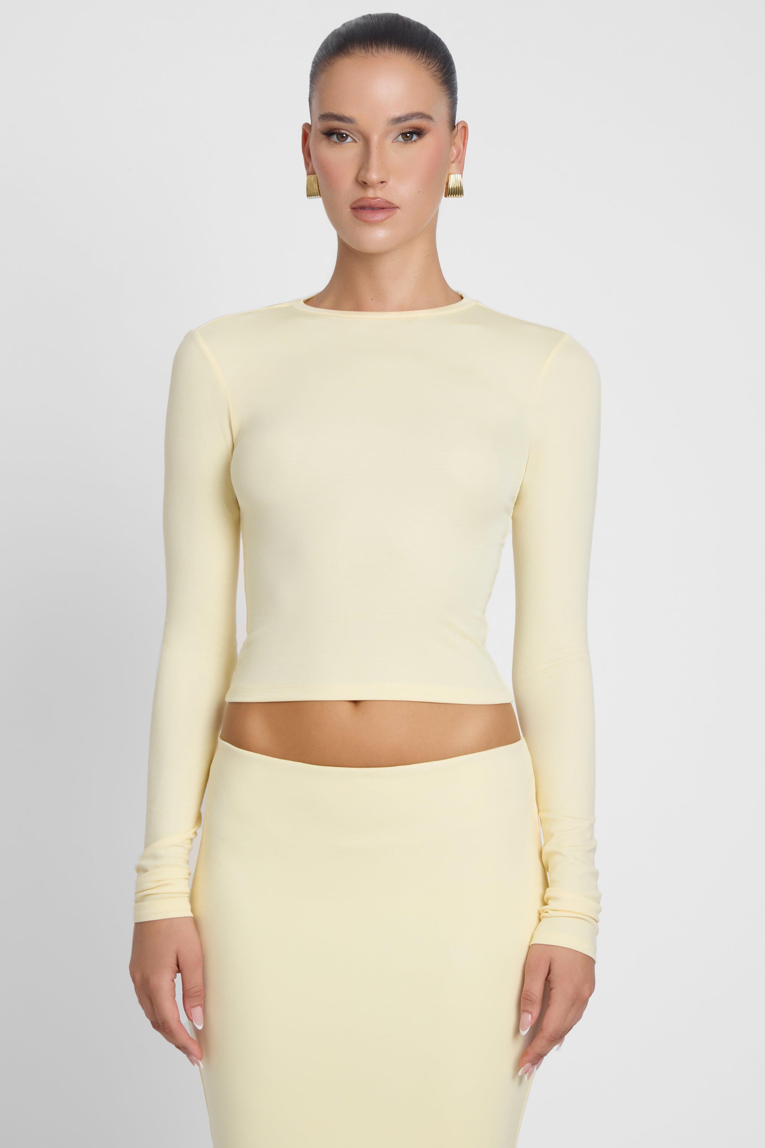 Model is wearing Everyday Jersey Long Sleeve Top Yellow, front view.