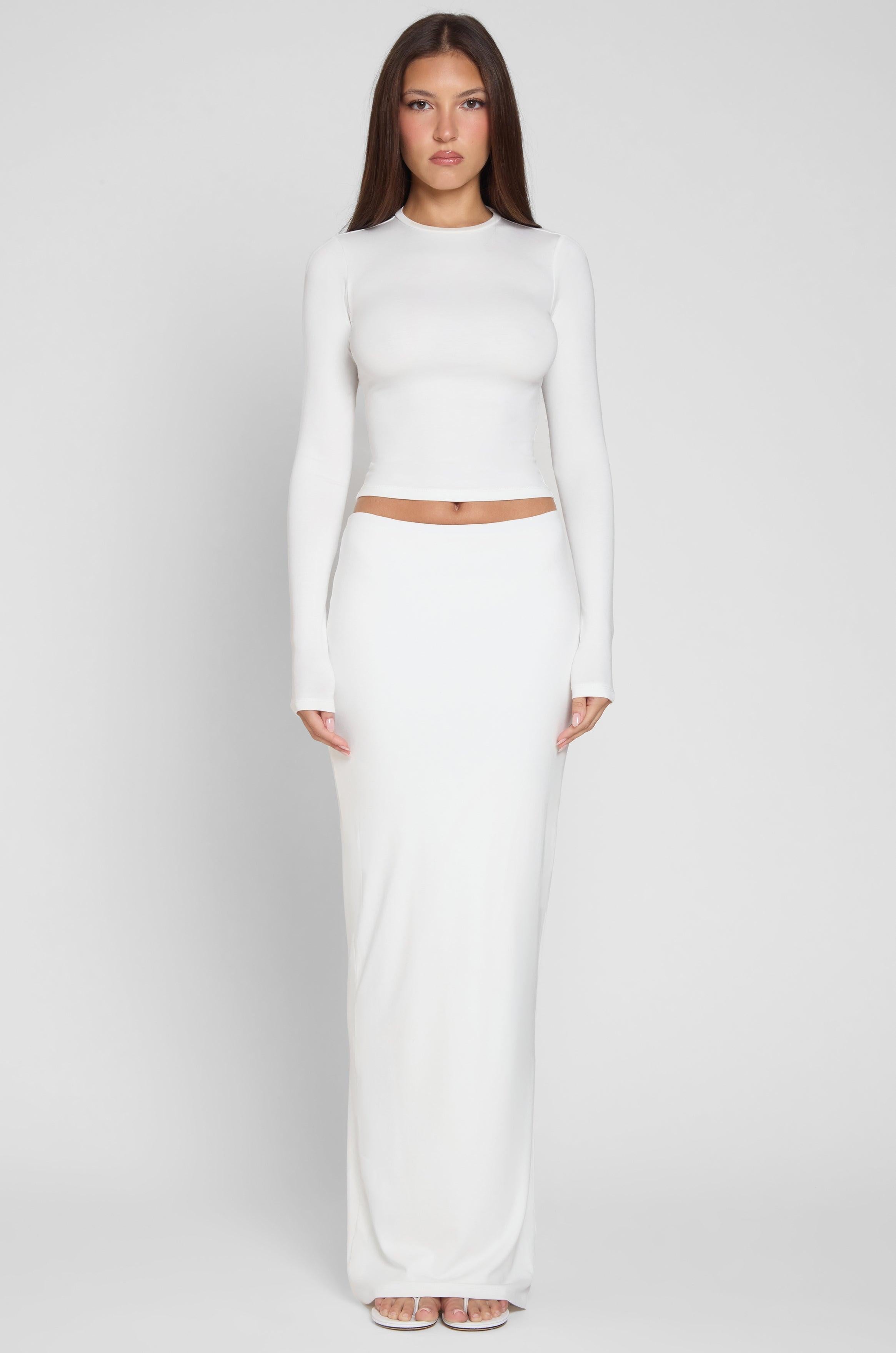 Model is wearing Everyday Jersey Maxi Skirt in White, front view.