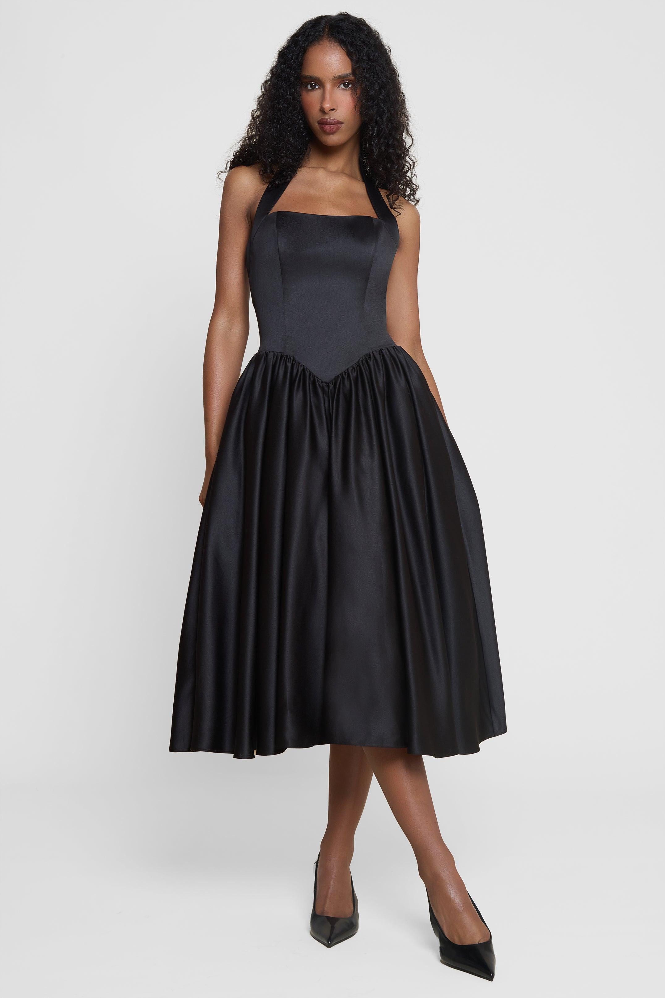 Model wearing Hart Halter Corset Midi Dress in Black, front view