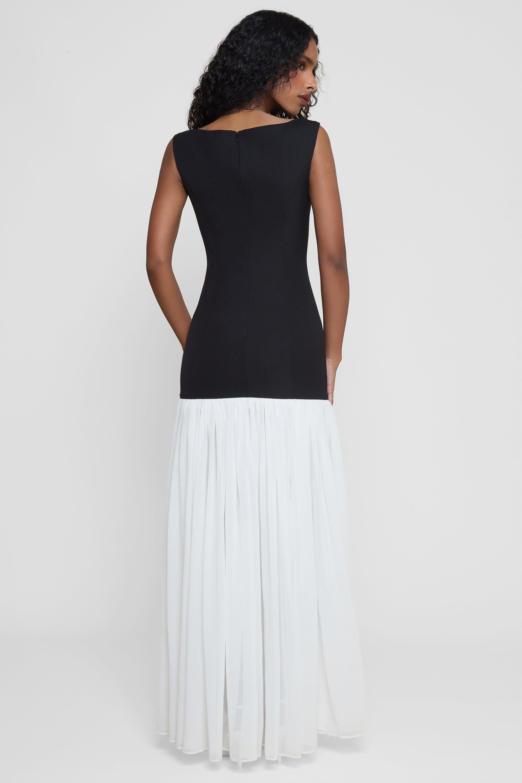 Model wearing Phantom Contrast Chiffon Maxi Dress in Black/White, back view.