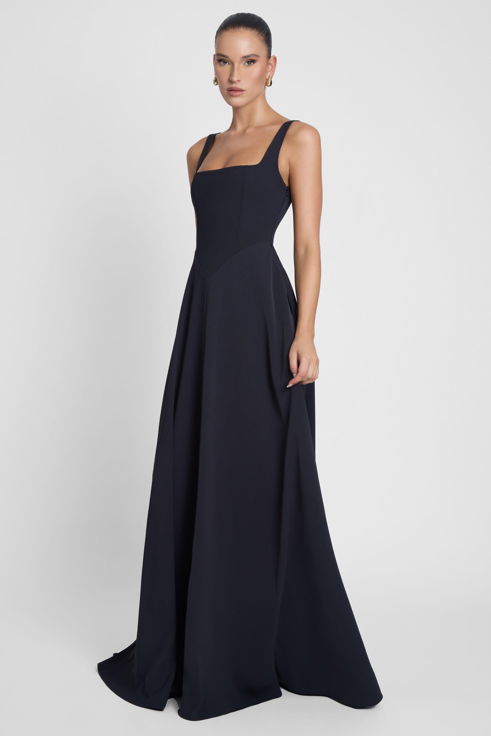 Model is wearing Siren Square Neck Corset Maxi Dress Black, front view.