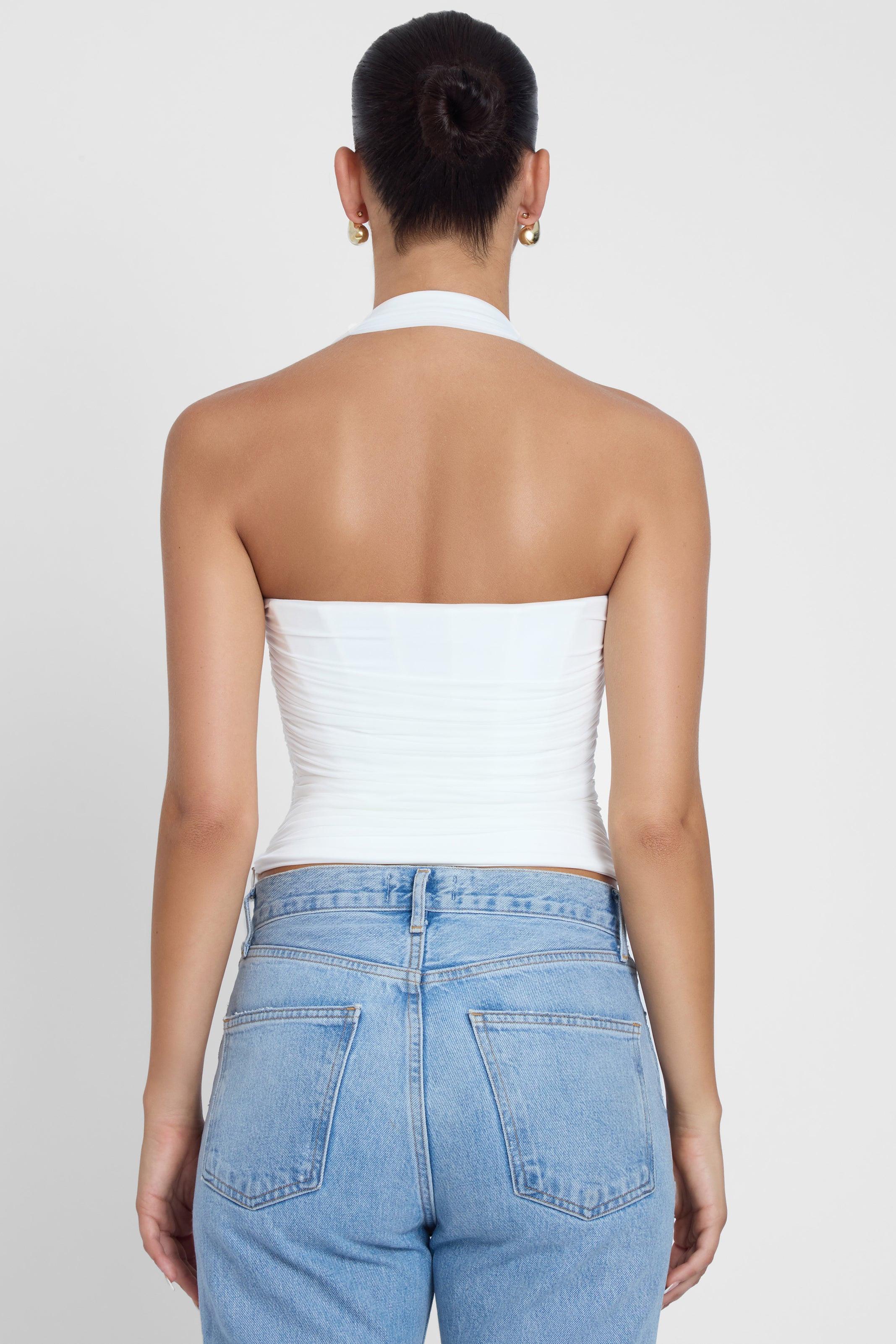 Model is wearing Taormina Halter Corset Top White, back view.