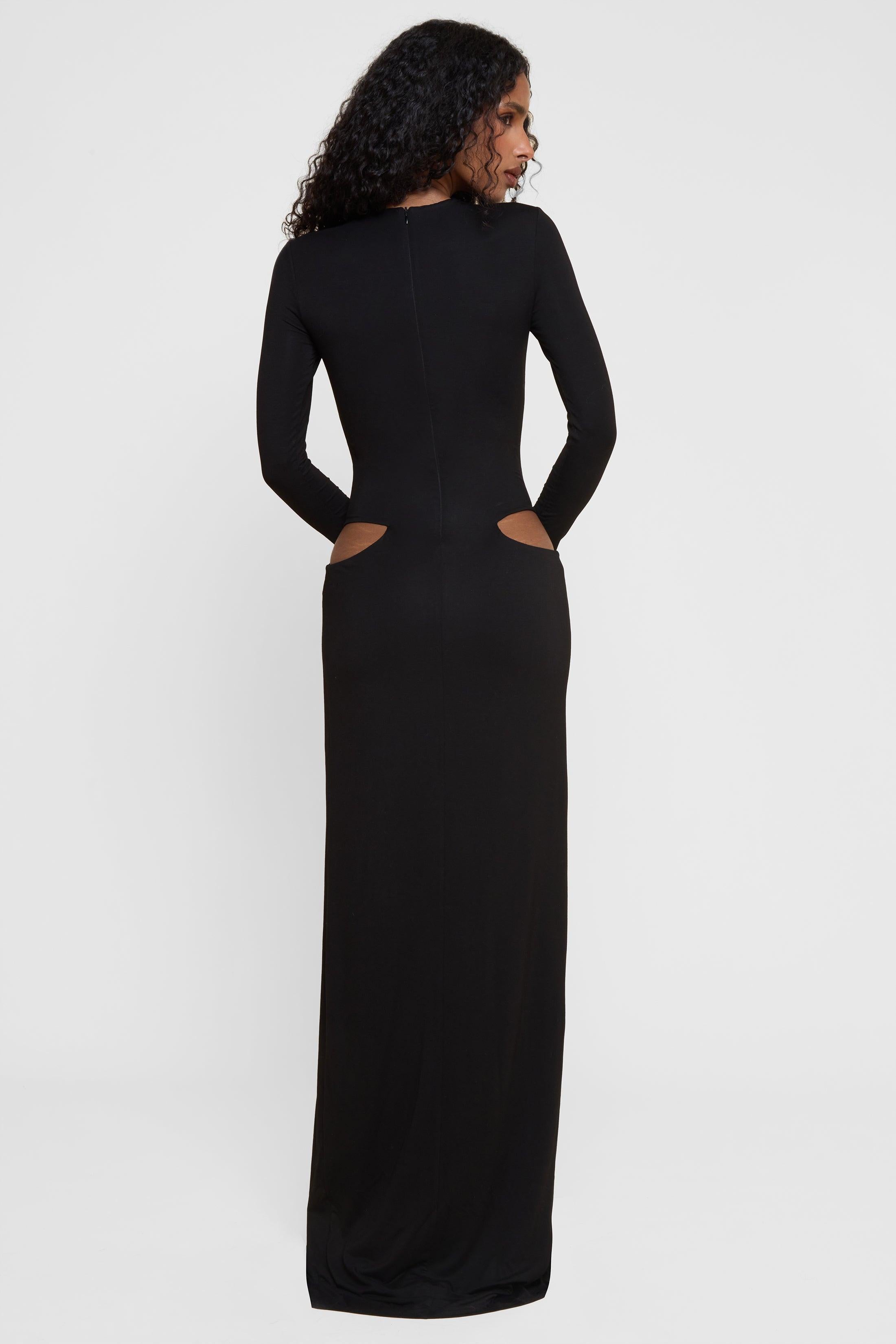 Model wearing Vacanza Drape Gown in Black, back view.