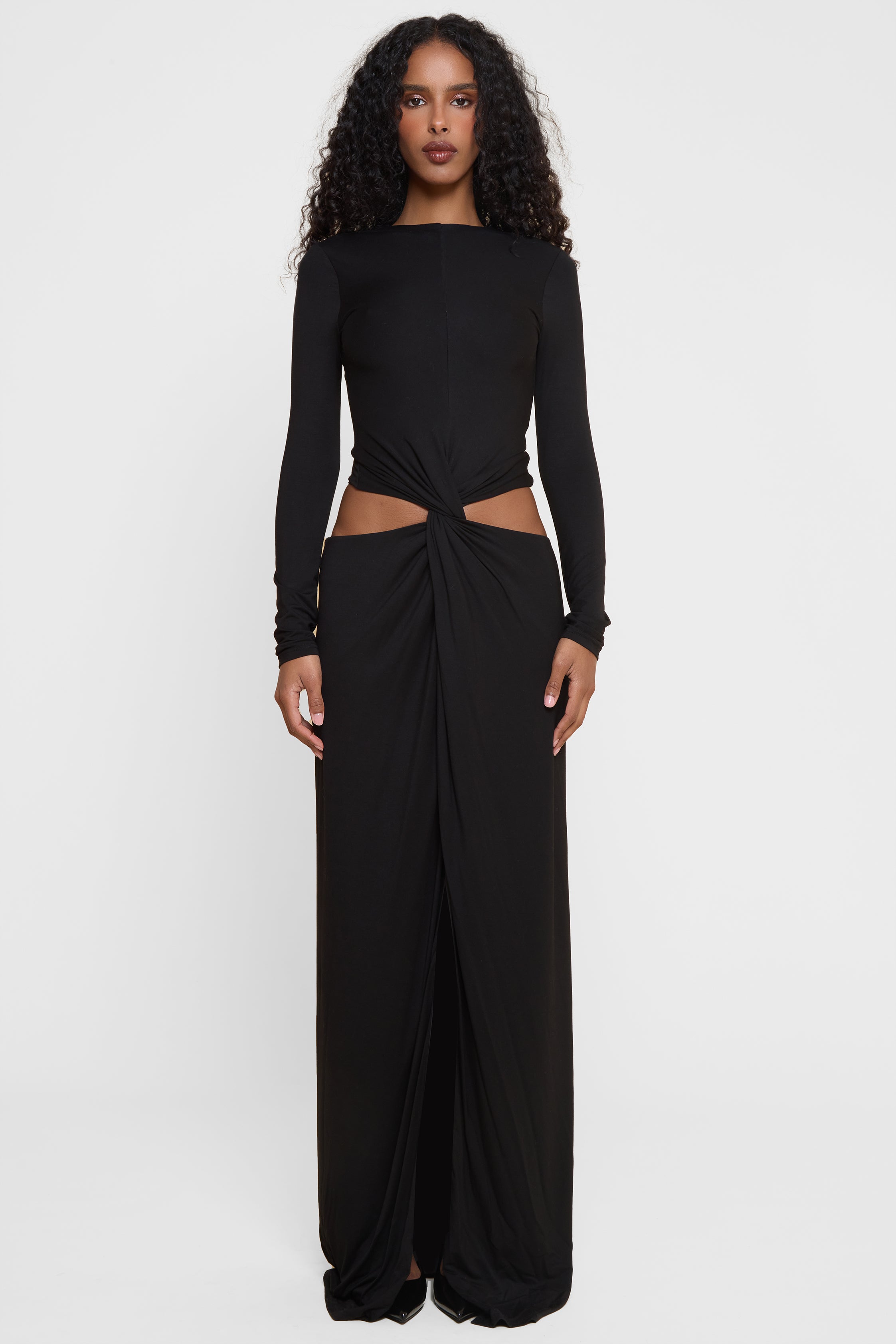 Model wearing Vacanza Drape Gown in Black, front view.