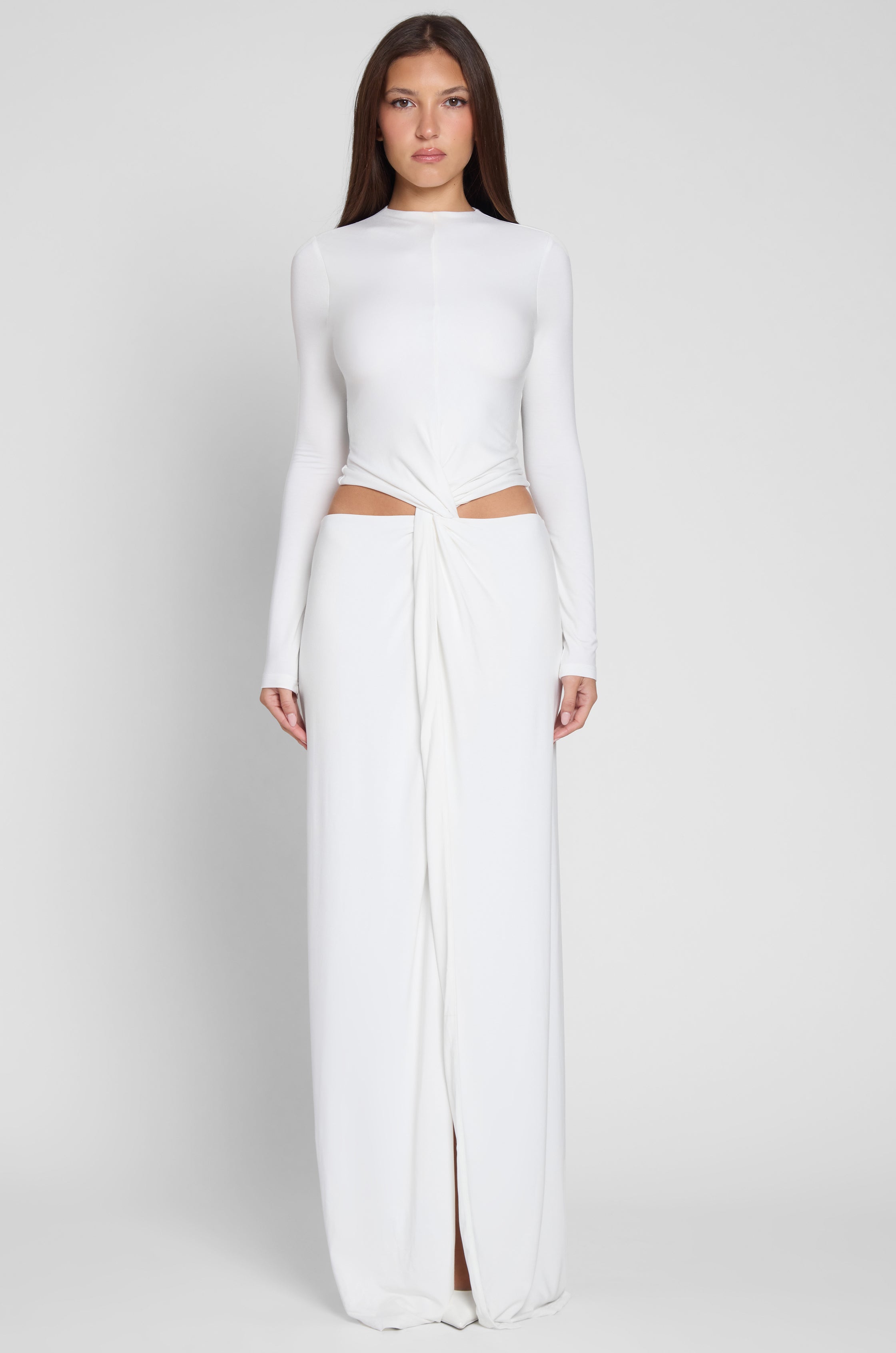 Model wearing Vacanza Drape Gown in White, front view.