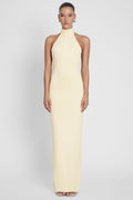 Model is wearing Alaia Drape Maxi Dress Yellow, front view.