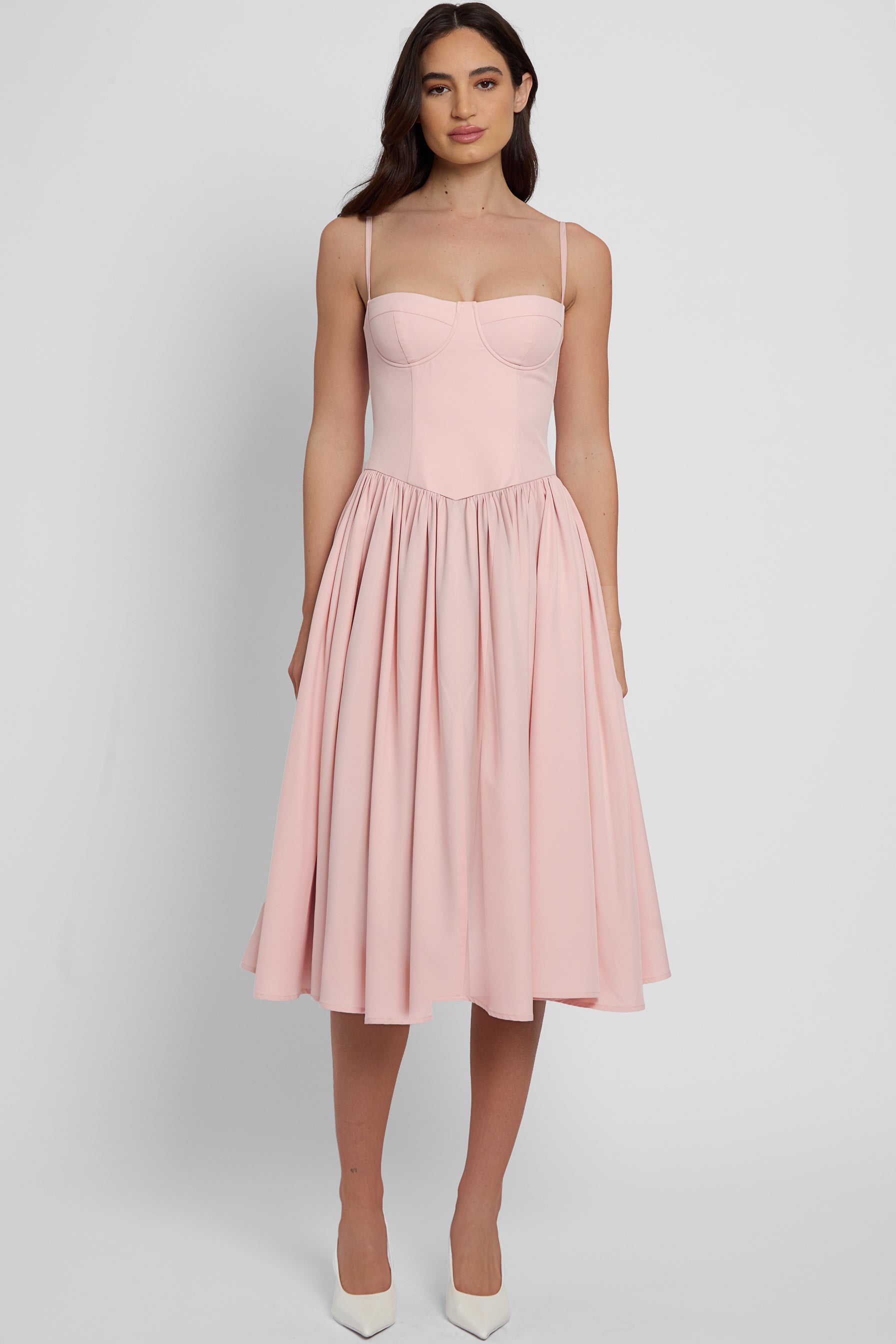 Model wearing Ballerina Bustier Midi Dress in Pink, front view.