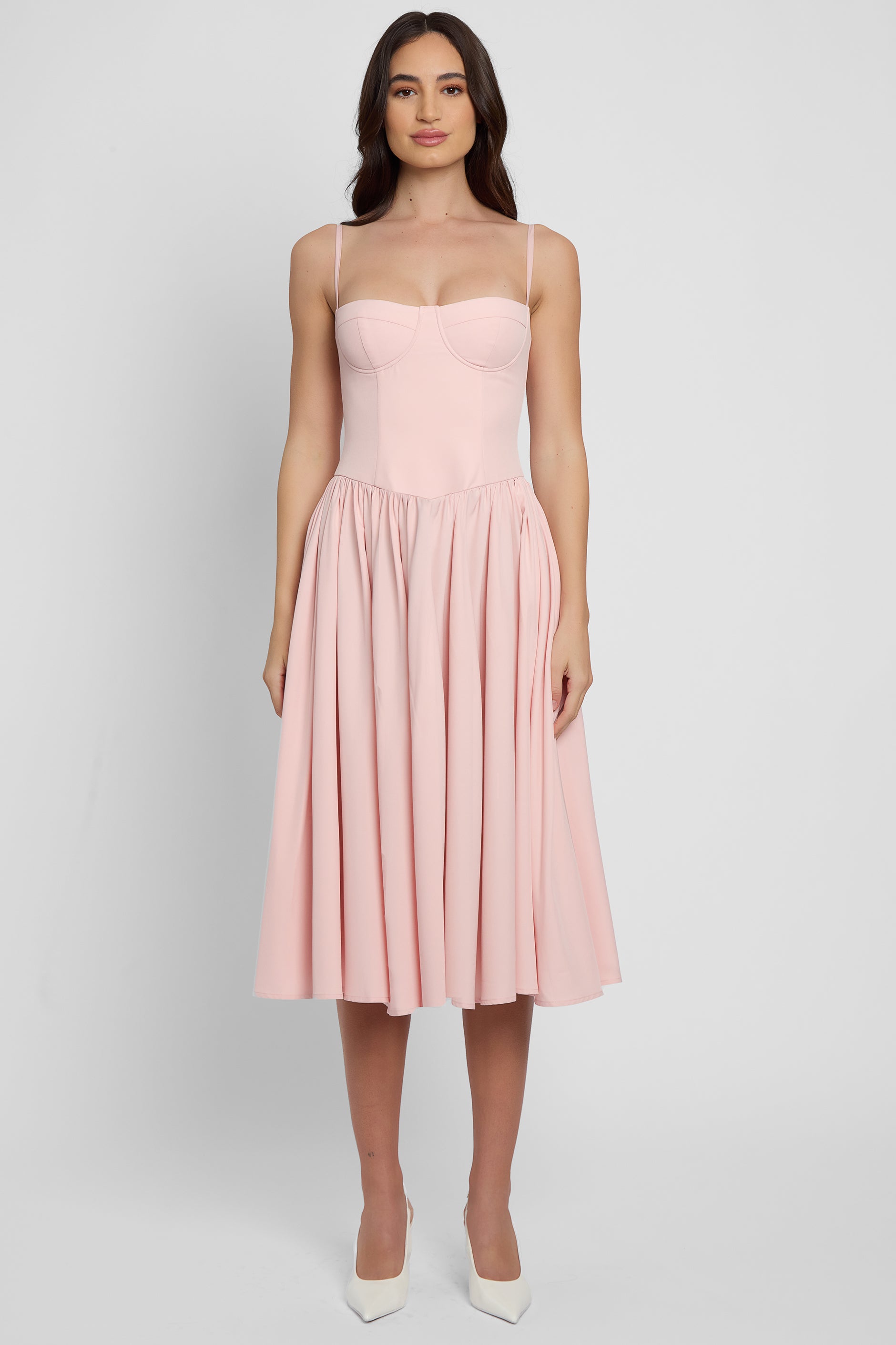 Model wearing Ballerina Bustier Midi Dress in Pink, front view.