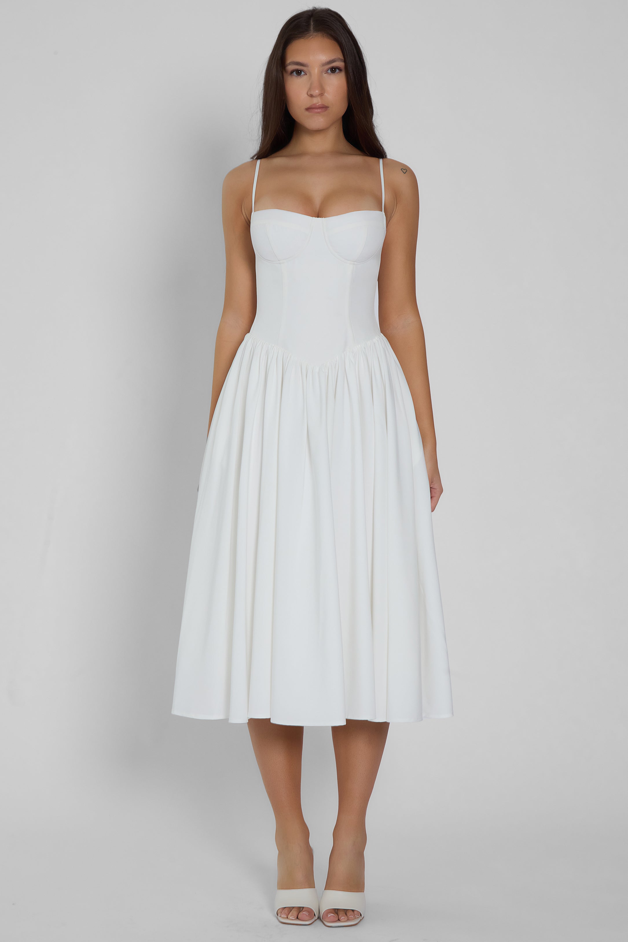 Model wearing Ballerina Bustier Midi Dress in White, front view.
