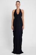 Model is wearing Cascade Drape Gown Black in Black, front view.