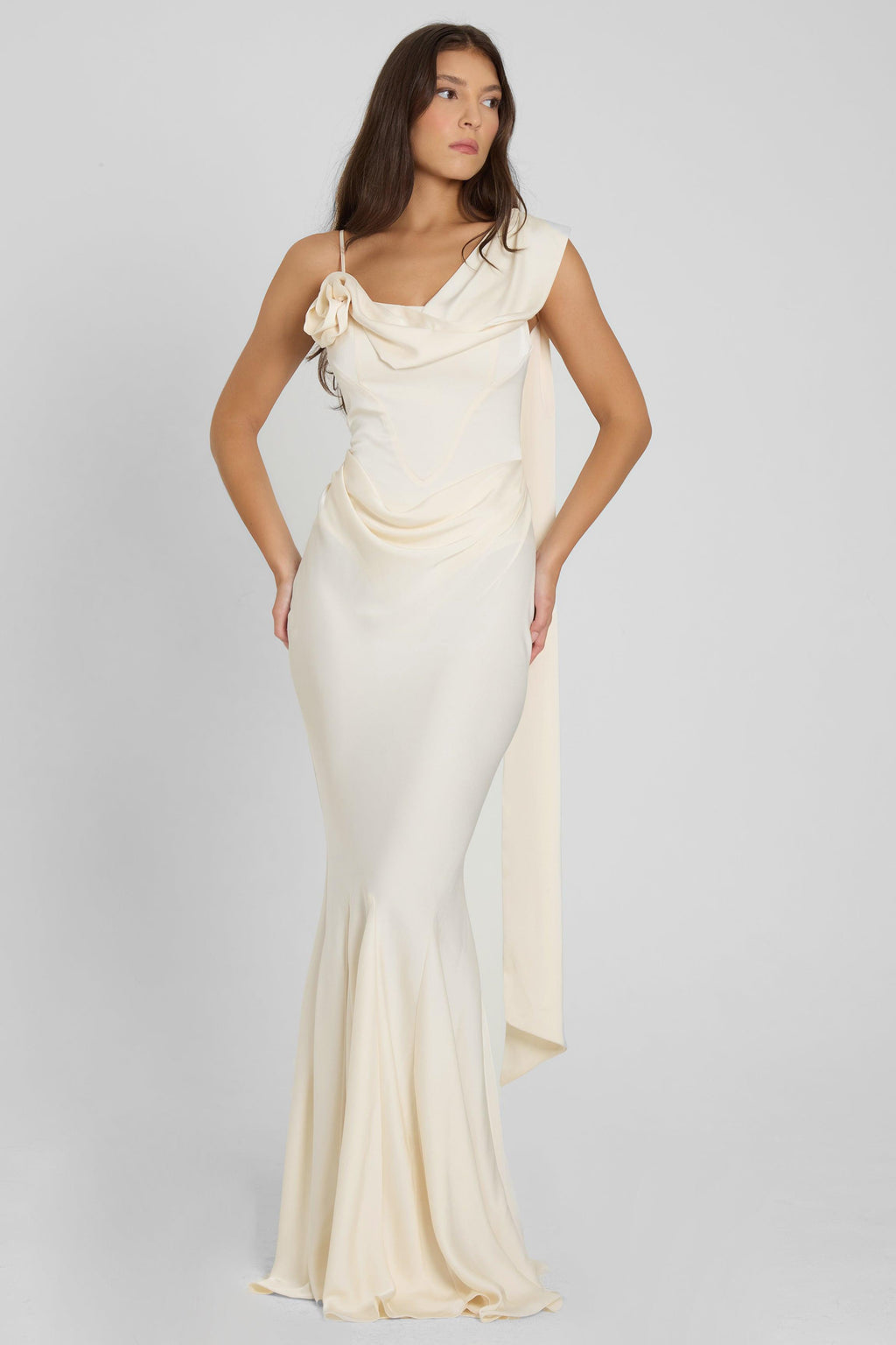 Model is wearing Celine Corset Drape Satin Gown in Ivory, front view.
