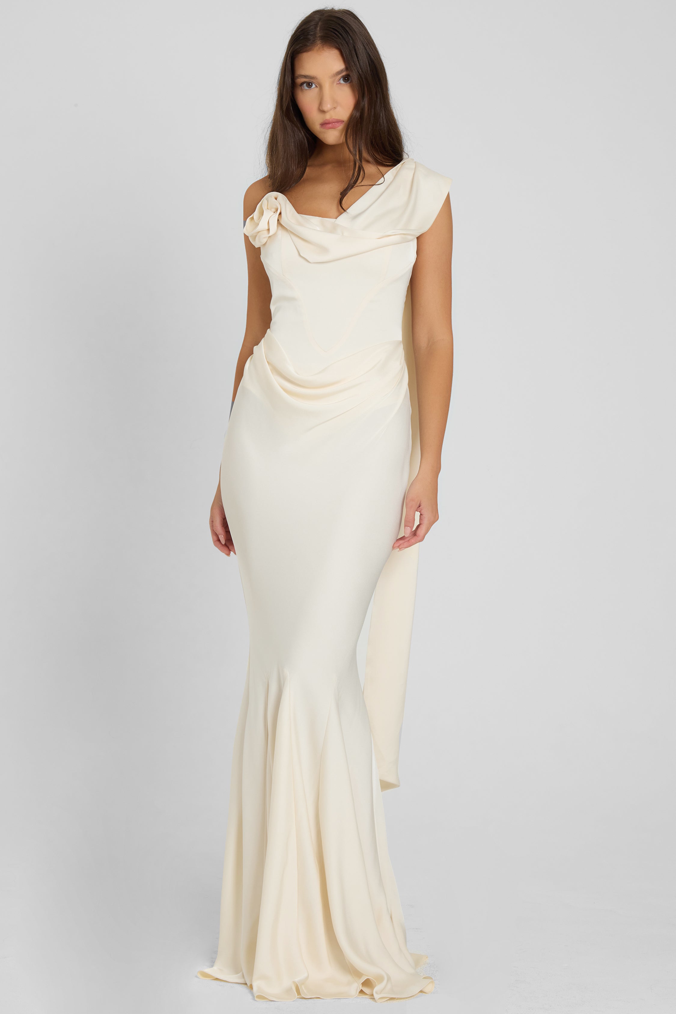 Model wearing LEAU Celine Corset Drape Satin Gown in Ivory, front view.