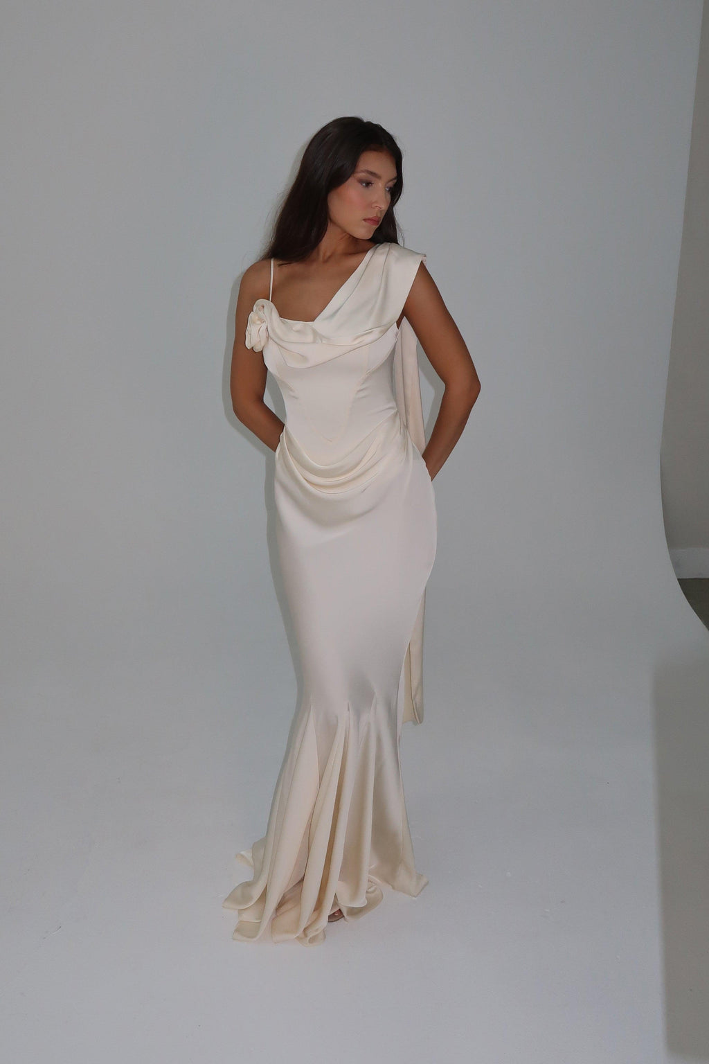 Model wearing Celine Corset Drape Satin Gown in Ivory, front view.
