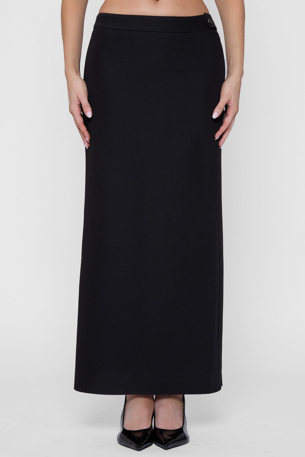 Model wearing Classic Column Maxi Skirt in Black, front view.