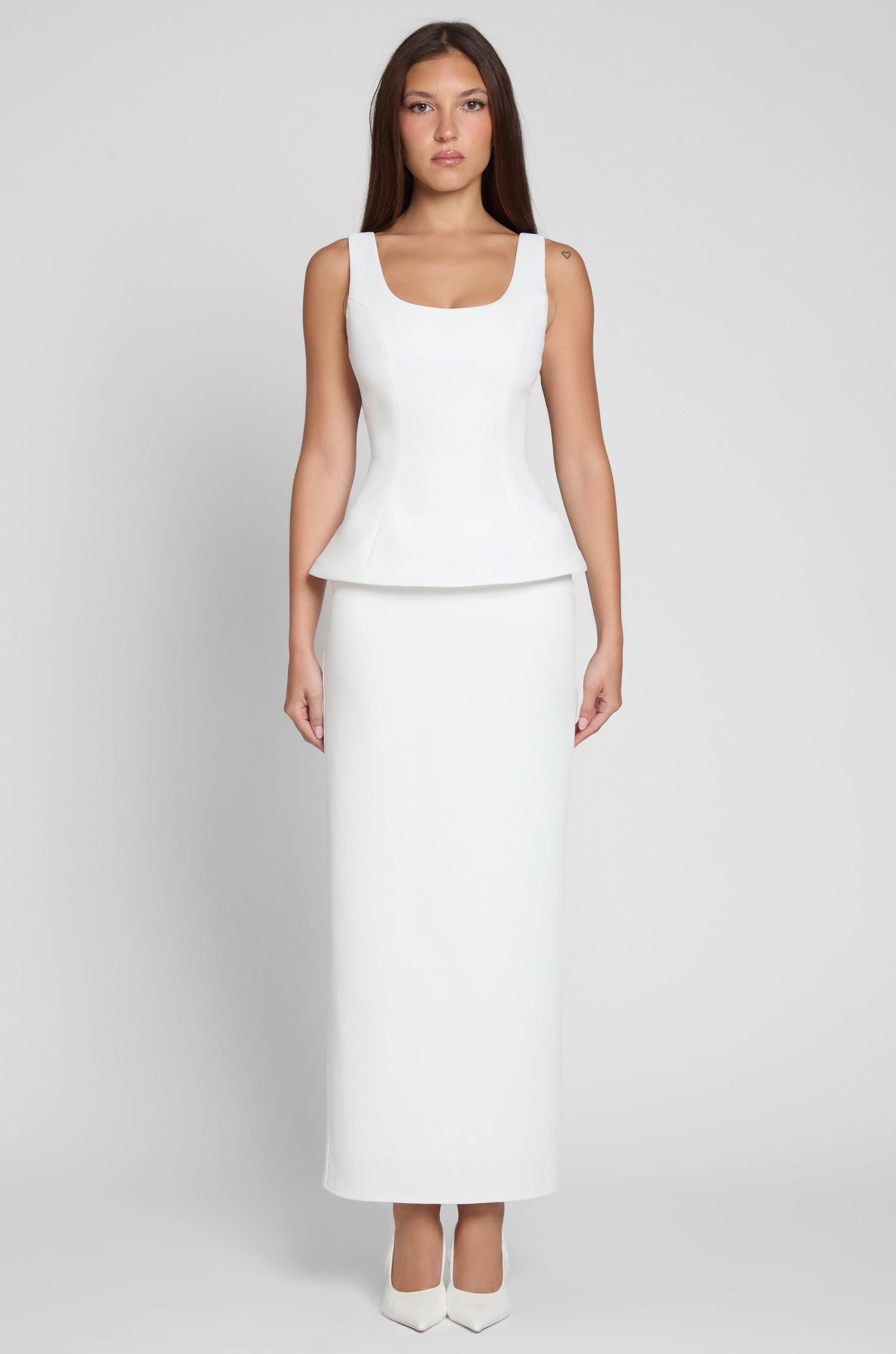 Model is wearing Classic Column Maxi Skirt in White, front view.