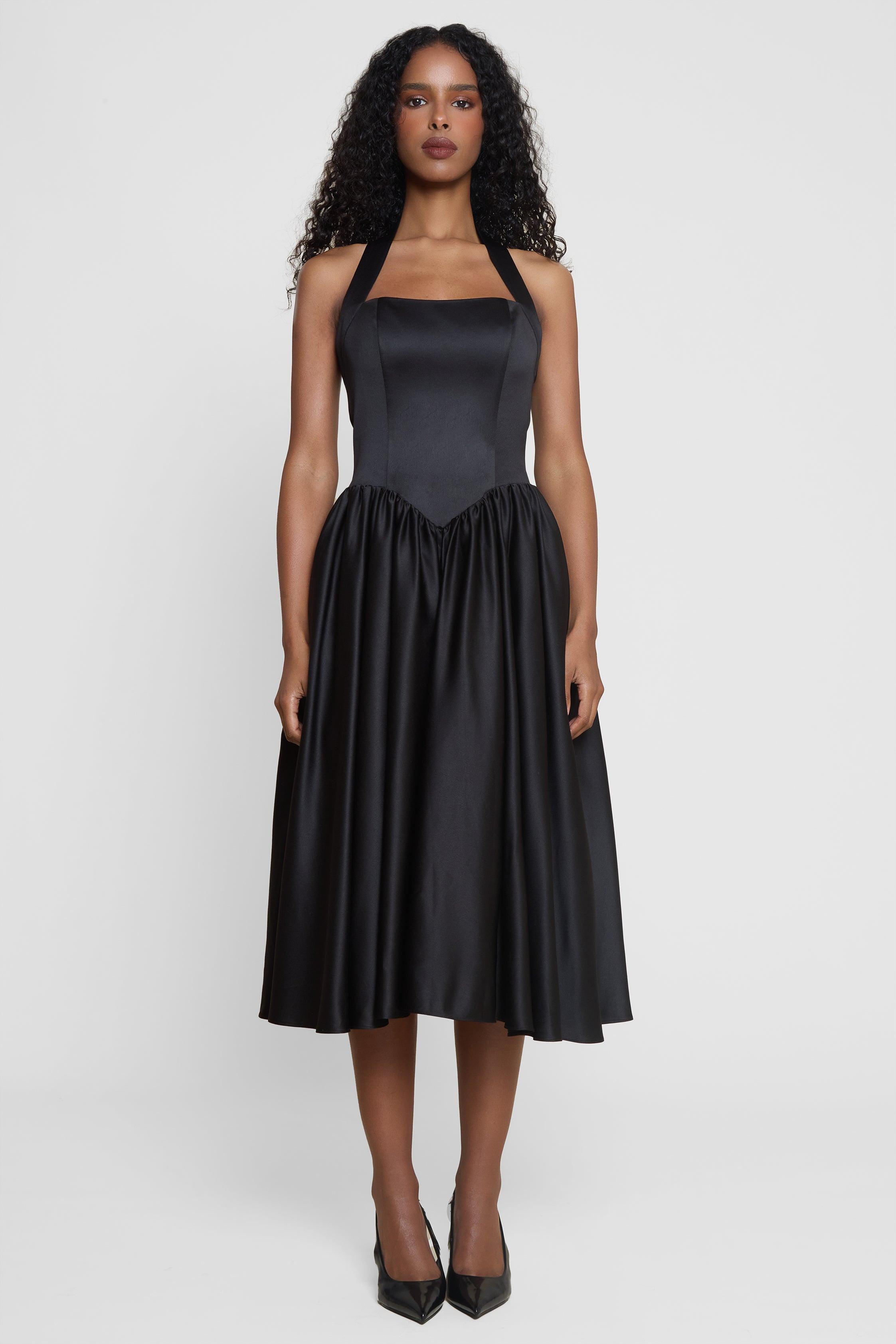 Model wearing Hart Halter Corset Midi Dress in Black, front view