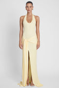Model is wearing Heaven Halter Jersey Knot Maxi Dress Yellow, front view.