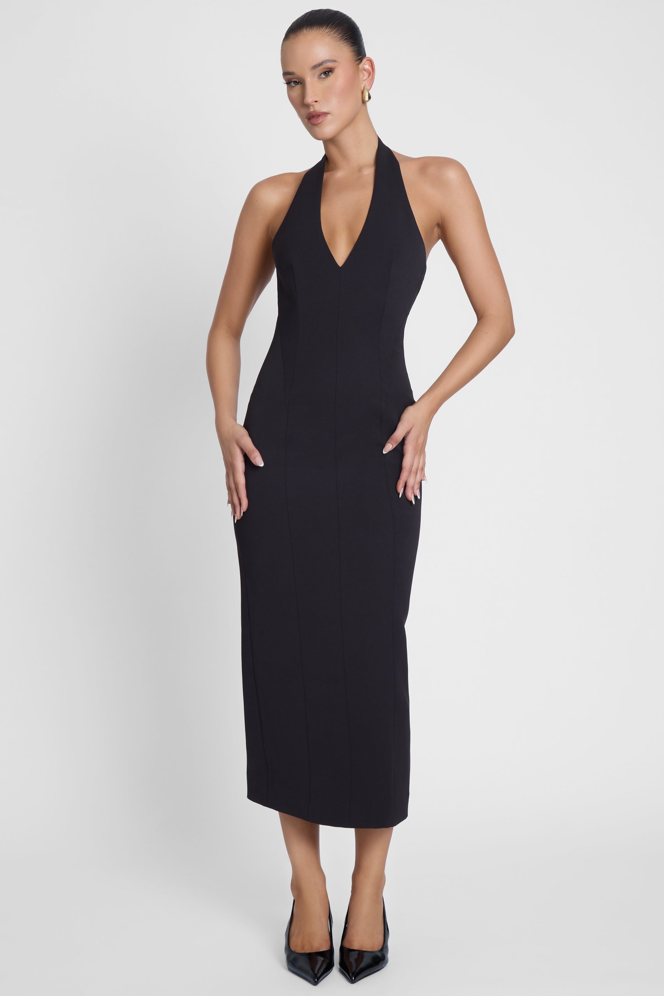 Model is wearing Cairo Hourglass Belted Coat Black, front view.