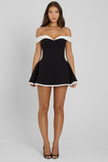 Model wearing Ramona Contrast Corset Babydoll Mini Dress in Black, front view.