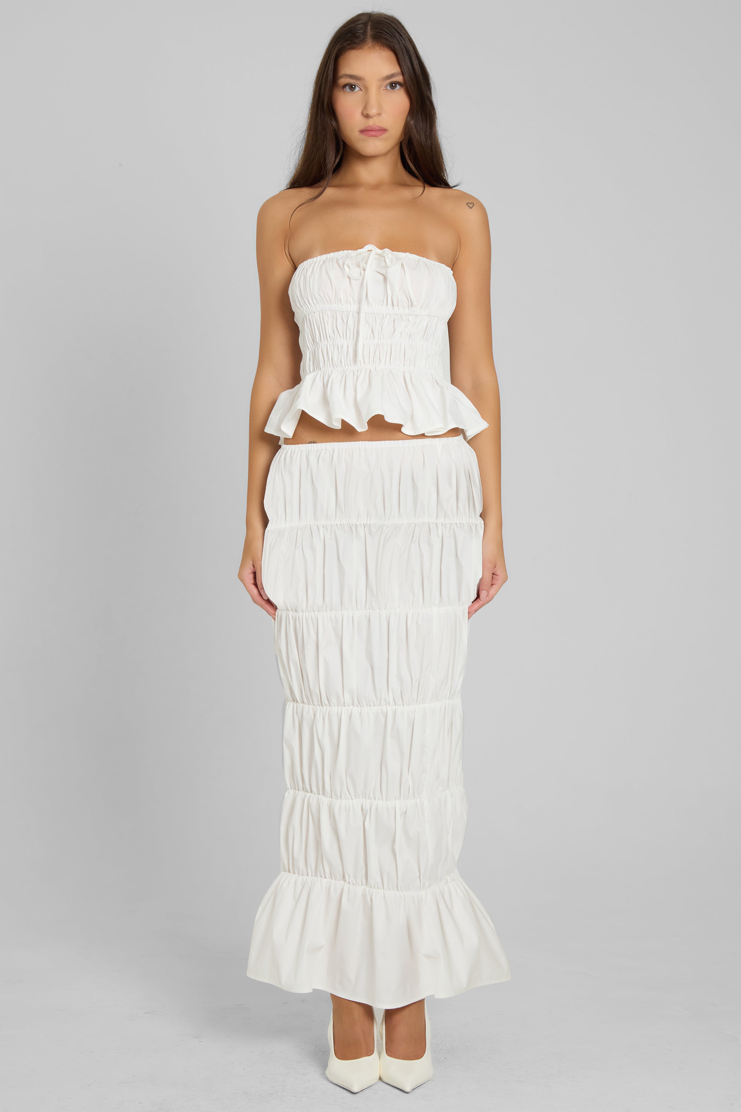 Model wearing Reverie Ruffle Two Piece Set in White, front view.