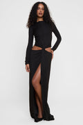 Model wearing Vacanza Drape Gown in Black, front view.